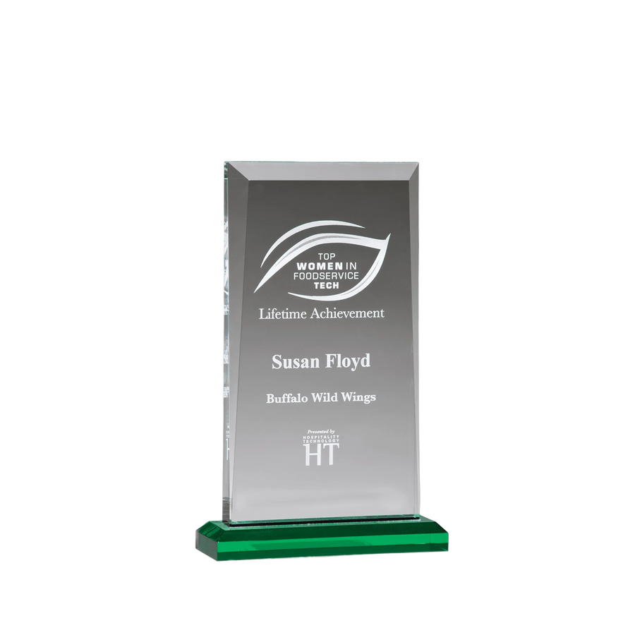 Clear glass award with engraved text on a green base