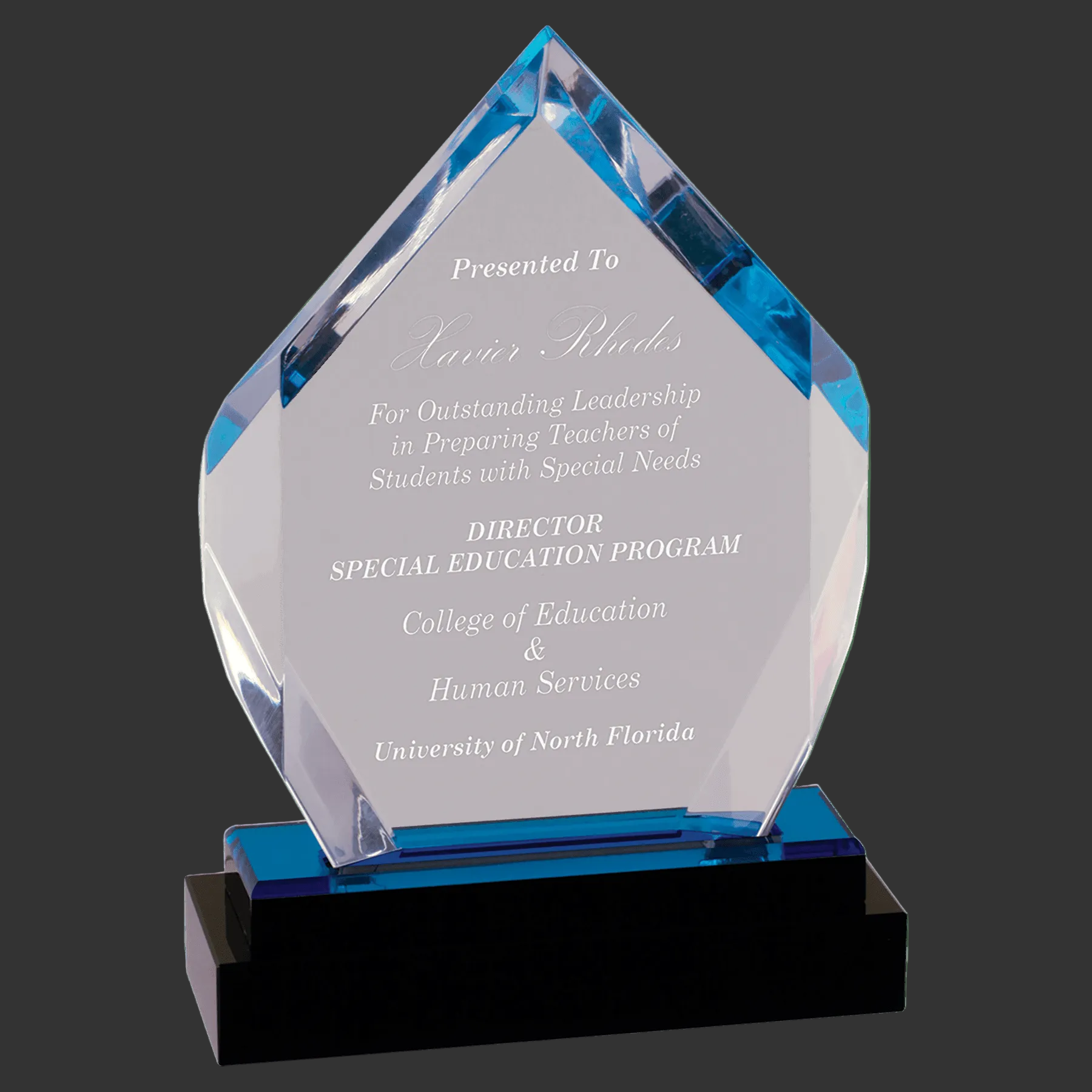 Acrylic award with engraved text on a clear background