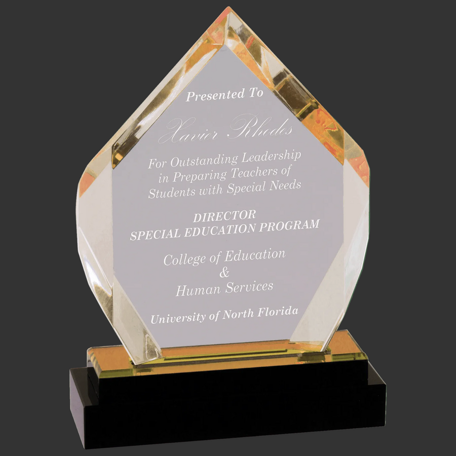 Academic award with engraved text on a clear background