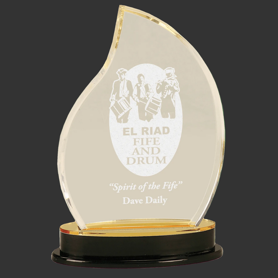 Acrylic award with engraved text on a clear background