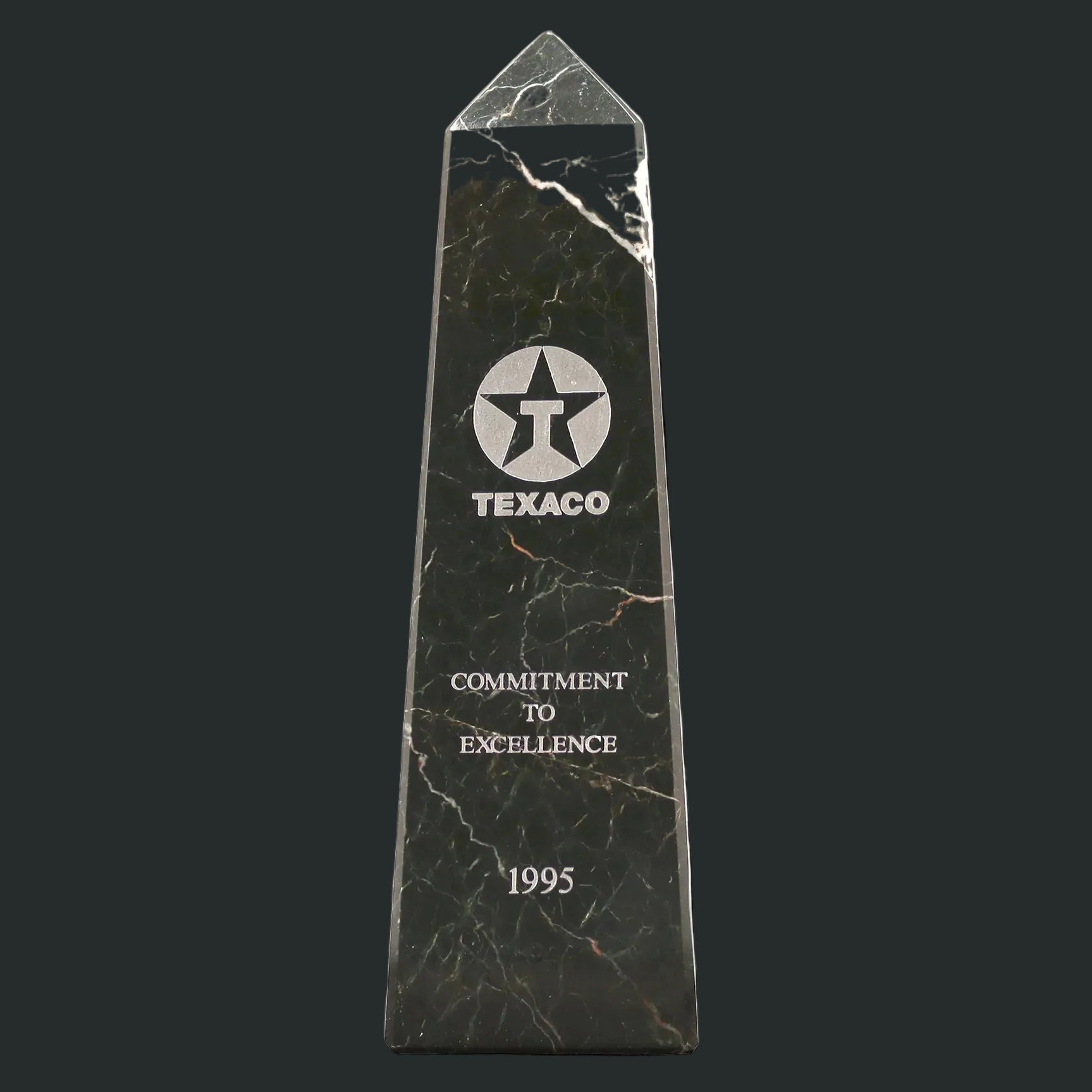 Black marble award with Texaco logo and text on a white background