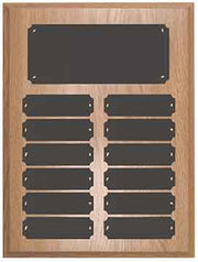 Wooden plaque with multiple black rectangular plates